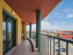 a balcony with a view of a parking lot at Apartment Appartamento Pietrasanta by Interhome in Pietrasanta
