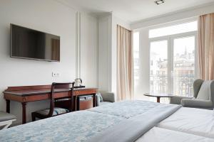 Postel nebo postele na pokoji v ubytování Hotel de Londres y de Inglaterra