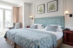 Postel nebo postele na pokoji v ubytování Hotel de Londres y de Inglaterra