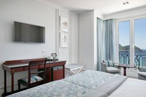 Postel nebo postele na pokoji v ubytování Hotel de Londres y de Inglaterra