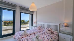 Ένα ή περισσότερα κρεβάτια σε δωμάτιο στο Villa Mónaco Conil de la Frontera by Ruralidays +36 φωτογραφίες