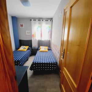 A bed or beds in a room at Xeraco Beach Alma