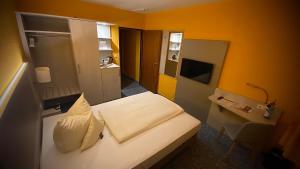 Postel nebo postele na pokoji v ubytování Hotel Windspiel