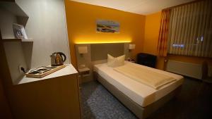 Postel nebo postele na pokoji v ubytování Hotel Windspiel