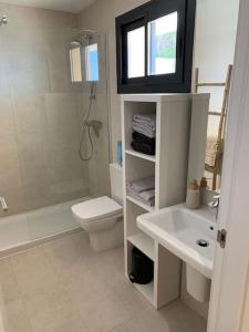 a bathroom with a sink and a toilet and a shower at Prachtig appartement met zeezicht in Estepona Costa del Sol in Estepona +29 photos