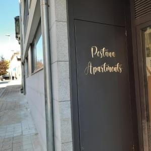 a sign on the side of a building at Pestana Apartments - Premium in Porto