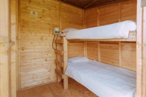 Postel nebo postele na pokoji v ubytování Event Lodge Glamping Spielberg