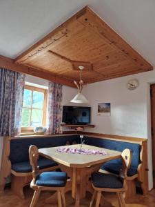 a dining room with a table and chairs at Haus Frei-Nagele in Alpbach