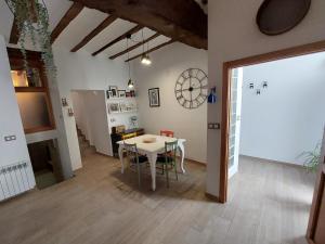 a dining room with a white table and chairs at Ca La Abuela in Requena +34 photos