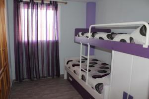 A bed or beds in a room at Xeraco Beach Alma