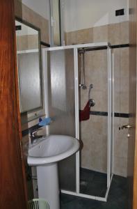 a bathroom with a sink and a shower at Palazzo De Donno in Santa Cesarea Terme