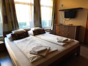 Postel nebo postele na pokoji v ubytování Médea Apartman + 34 fotografií