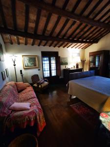 a bedroom with a bed and a table in a room at Casale Druida in Poggio Mirteto
