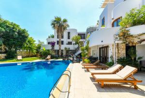 an image of a villa with a swimming pool at Duplex House with Shared Pool near Beach in Kalkan in Kalkan