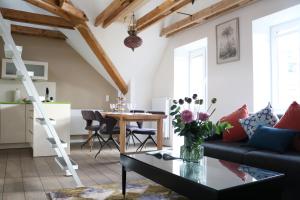 a living room with a couch and a table at Wohnung bei Façon in Eckernförde