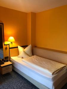 Postel nebo postele na pokoji v ubytování Hotel Windspiel