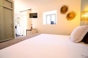 Postel nebo postele na pokoji v ubytování Stadthotel Santanyi