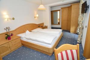Postel nebo postele na pokoji v ubytování Hotel Silvana