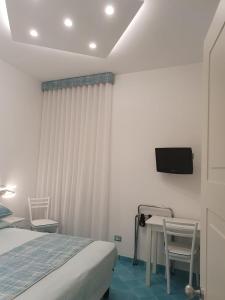 Cama o camas de una habitación en Albergo S. Andrea