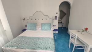 Cama o camas de una habitación en Albergo S. Andrea
