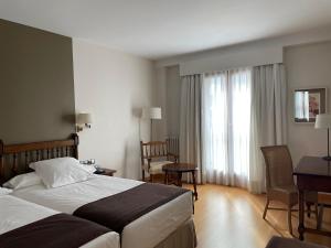 Łóżko lub łóżka w pokoju w obiekcie Parador de Puebla de Sanabria