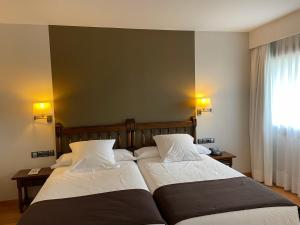 Łóżko lub łóżka w pokoju w obiekcie Parador de Puebla de Sanabria