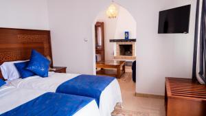 Postel nebo postele na pokoji v ubytování VILLA MATI Maison D'hôtes