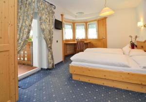 Postel nebo postele na pokoji v ubytování Hotel Silvana