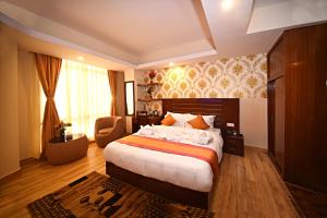 Rúm í herbergi á Hotel Simal