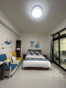 Postel nebo postele na pokoji v ubytování Sunshine Fonda Homestay