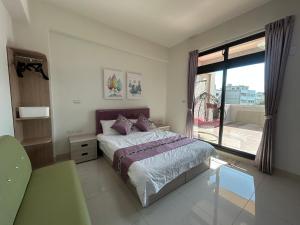 Postel nebo postele na pokoji v ubytování Sunshine Fonda Homestay