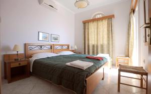 Posteľ alebo postele v izbe v ubytovaní Tinos View Apartments