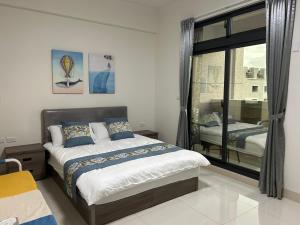 Postel nebo postele na pokoji v ubytování Sunshine Fonda Homestay