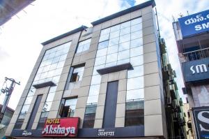 a building with glass windows on the side of it at Hotel Akshaya in Visakhapatnam