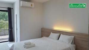 Кровать или кровати в номере Baan Lita +43 фотографии