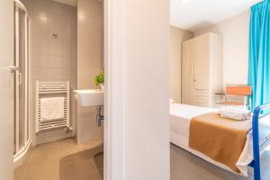 Cama o camas de una habitación en Albergue "El Río"