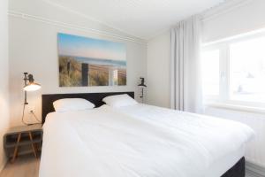 Hello Zeeland - Appartement Beatrixstraat 29 tesisinde bir odada yatak veya yataklar