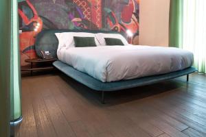 A bed or beds in a room at Atena Dolce Vita