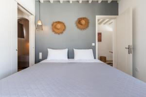 Posteľ alebo postele v izbe v ubytovaní Haka Suites Mykonos Town