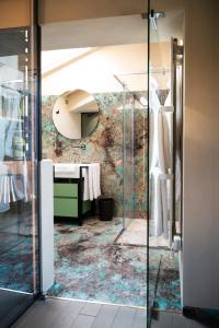 a bathroom with a sink and a mirror at Atena Dolce Vita in Brescia