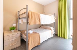 Cama o camas de una habitación en Albergue "El Río"