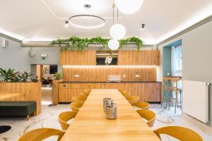 a large conference room with a long table and chairs at Luma Terra Prague Hostel in Prague
