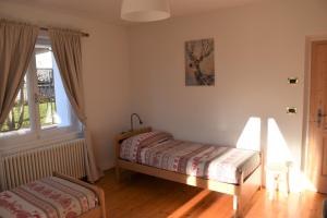 A bed or beds in a room at Casa Martina