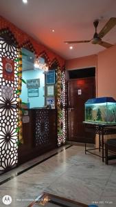 a lobby with a fish tank in a aquarium at Hotel Ajay International in Agra