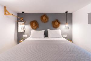 Posteľ alebo postele v izbe v ubytovaní Haka Suites Mykonos Town