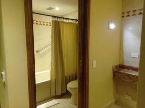 a bathroom with a toilet and a shower at Hotel El Prado in Barranquilla