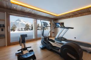 a gym with a view of a mountain at Chalet Le Ferme Combloux Rhone-Alps in Combloux