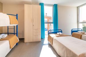 Cama o camas de una habitación en Albergue "El Río"