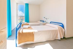 Cama o camas de una habitación en Albergue "El Río"