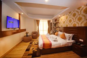 Rúm í herbergi á Hotel Simal